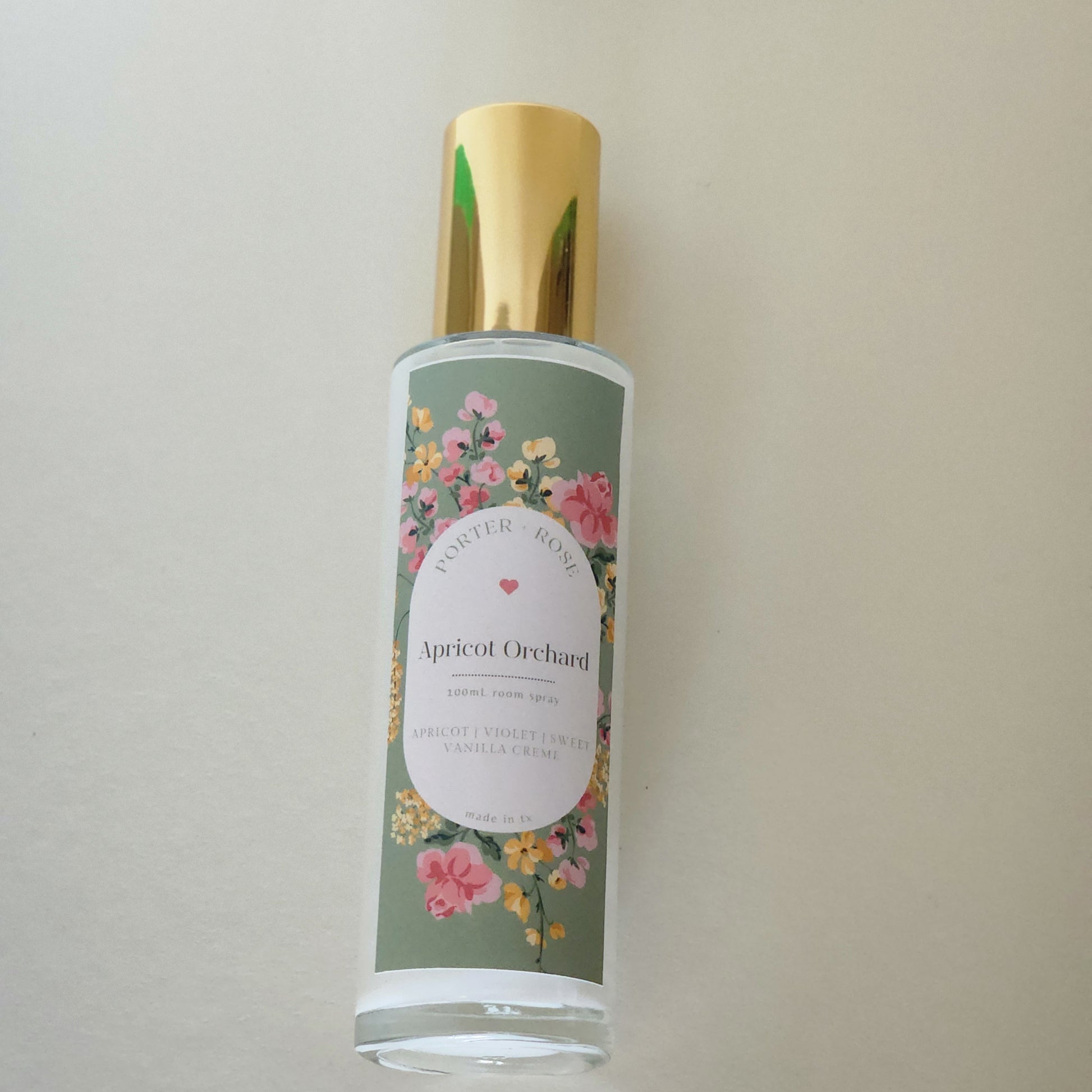 Apricot Orchard - sleek 100ml glass bottle with gold rim filled with light white spring scented room spray