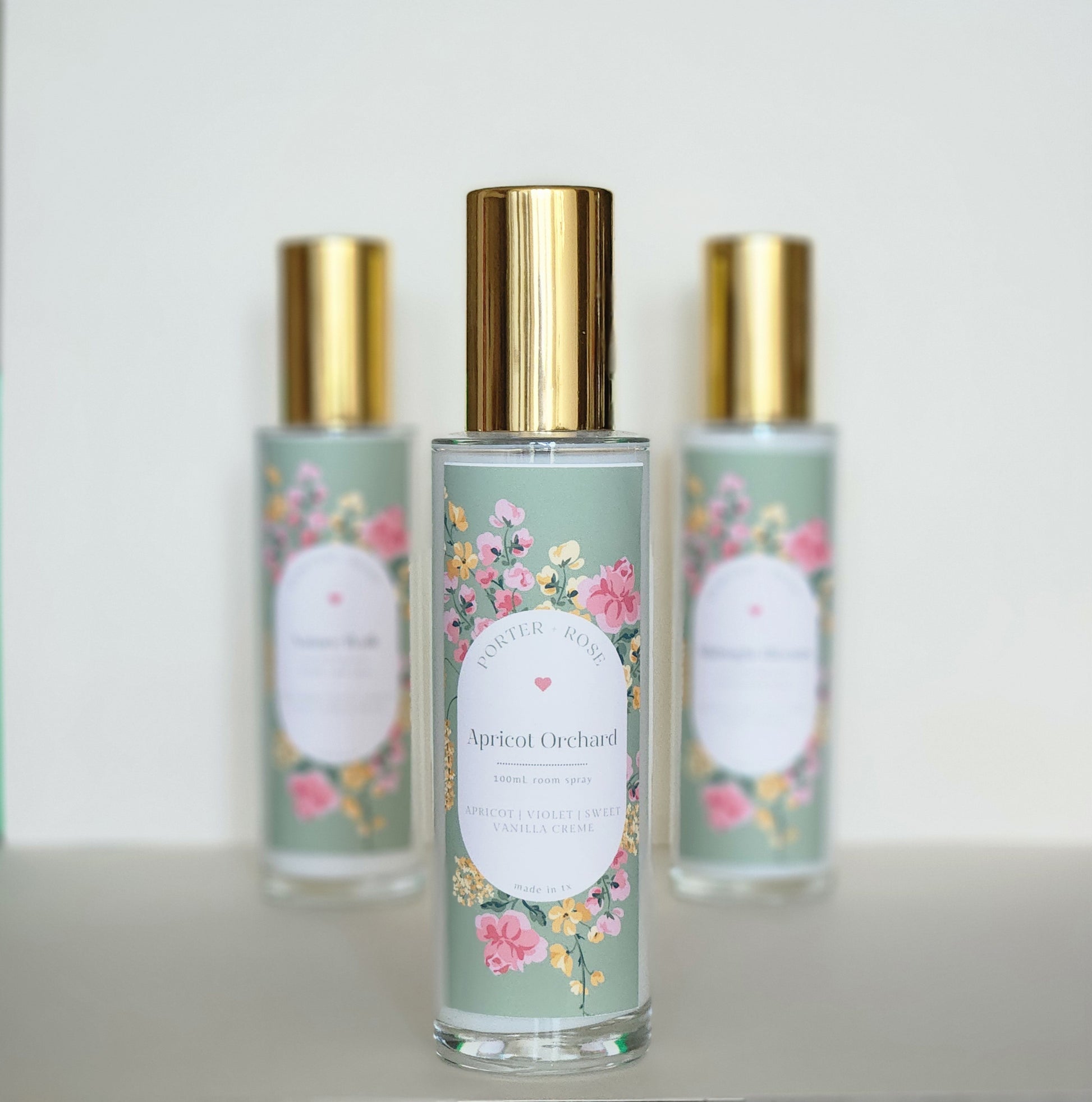 Apricot Orchard - sleek 100ml glass bottle with gold rim filled with light white spring scented room spray