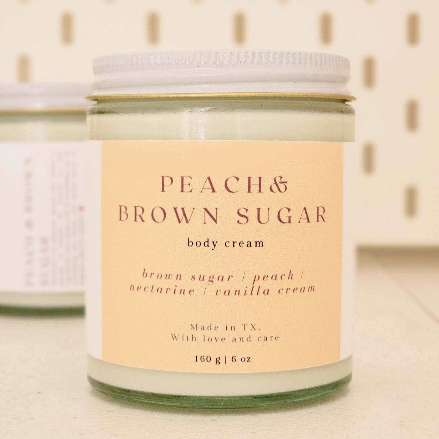 peach brown sugar body cream in heavy glass jar with white lid, 160g made in texas