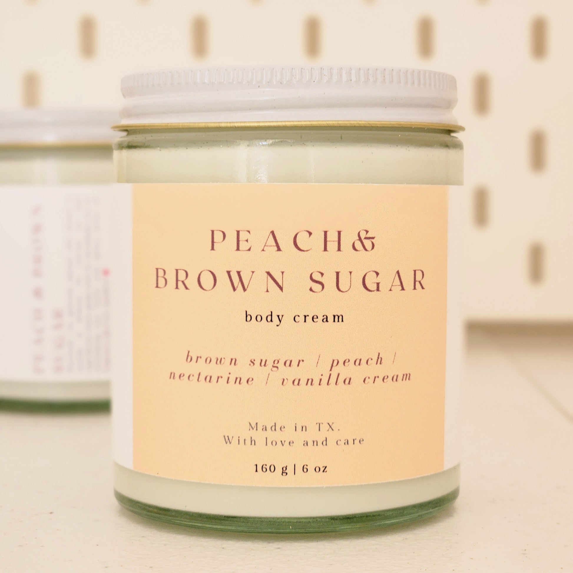 peach brown sugar body cream in heavy glass jar with white lid, 160g made in texas