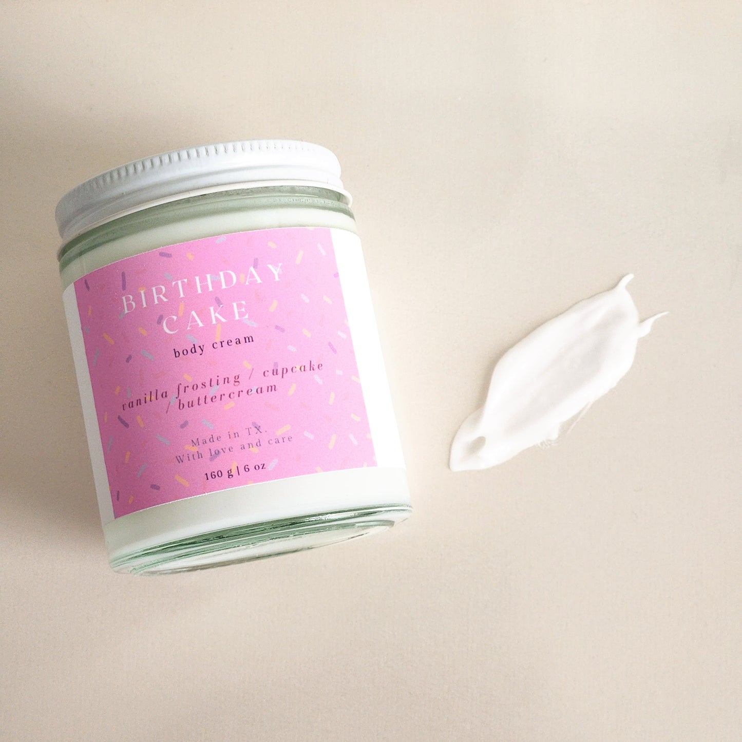 birthday cake body cream in clear glass heavy bottomed jar, 160g - sprinkle label pink - porter + rose