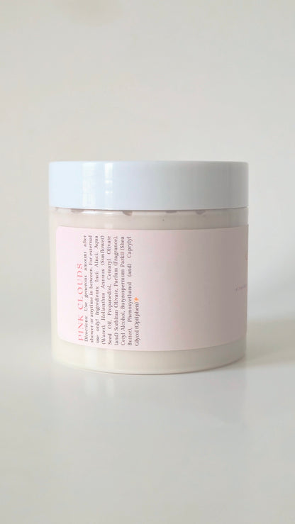 Pink Clouds body cream in a 175g plastic jar. A soft, whipped cream with notes of strawberry, marshmallow, and vanilla. Cute, girlie skincare.