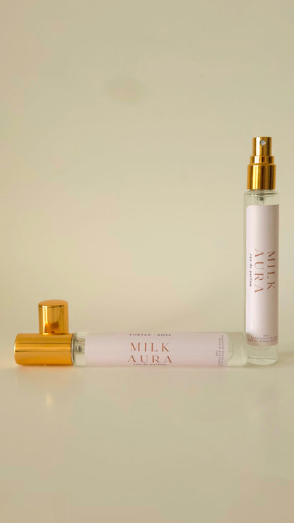 Two Milk Aura perfume bottles on a light beige background