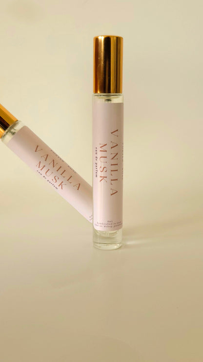 Two Vanilla Musk perfume bottles on a beige background