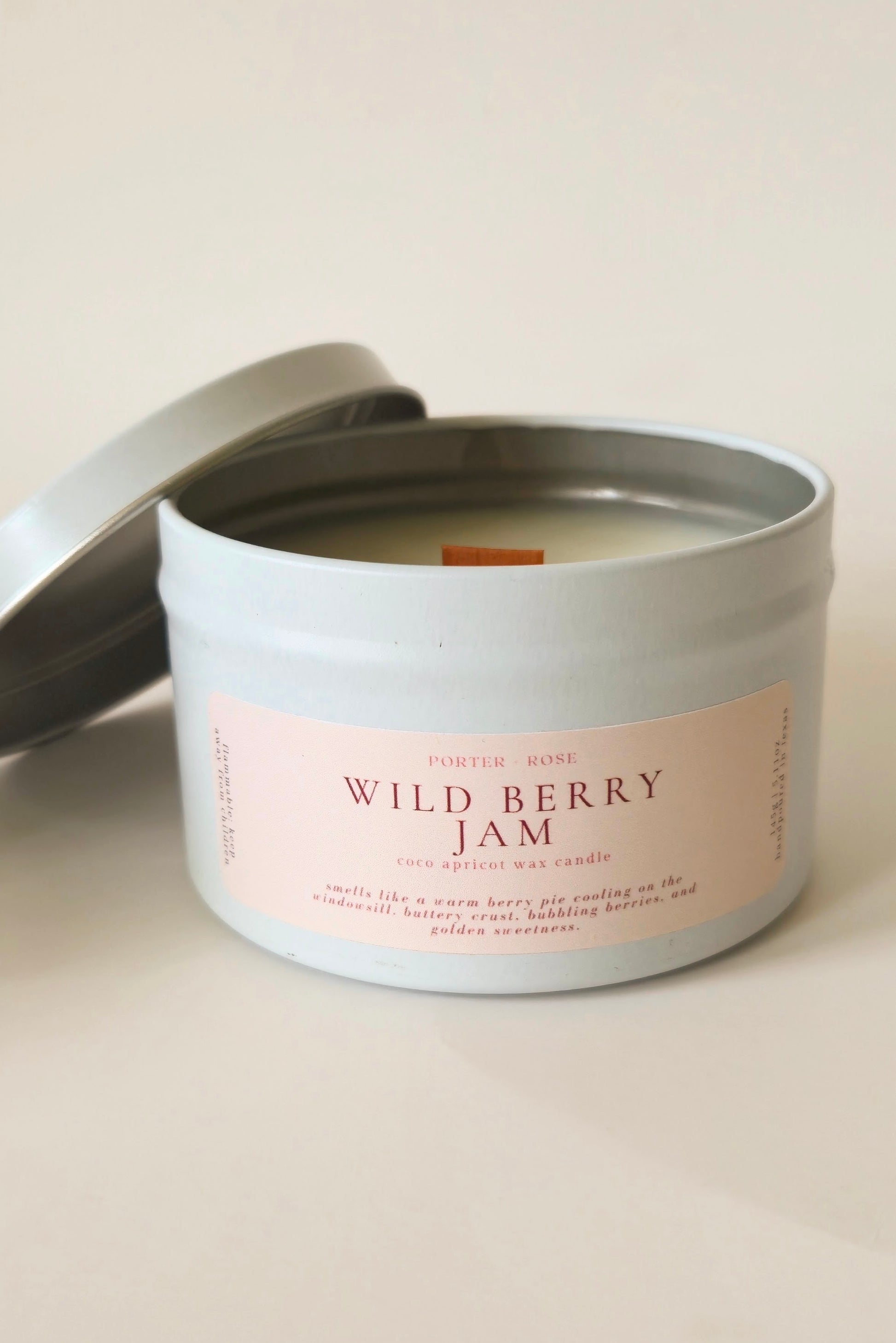Wild Berry Jam wooden wick candle in a 5oz white tin jar on a clean white background.