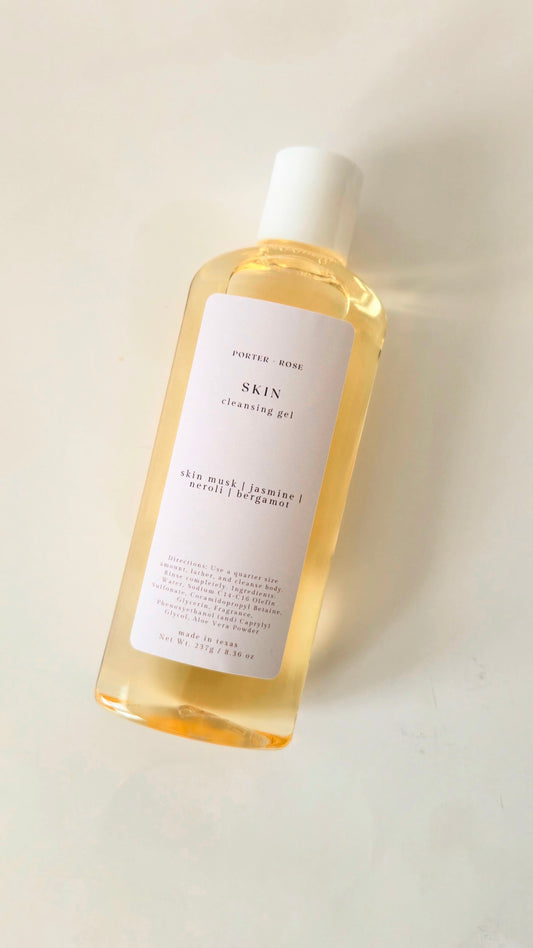 Bottle of 'SKIN' cleansing gel on a light background