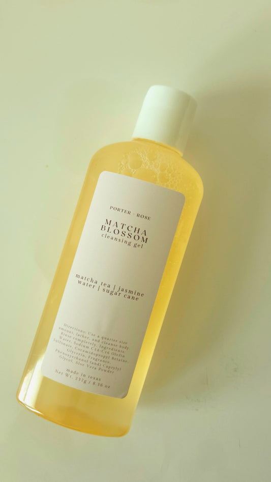 Matcha Blossom cleansing gel bottle on a light green background
