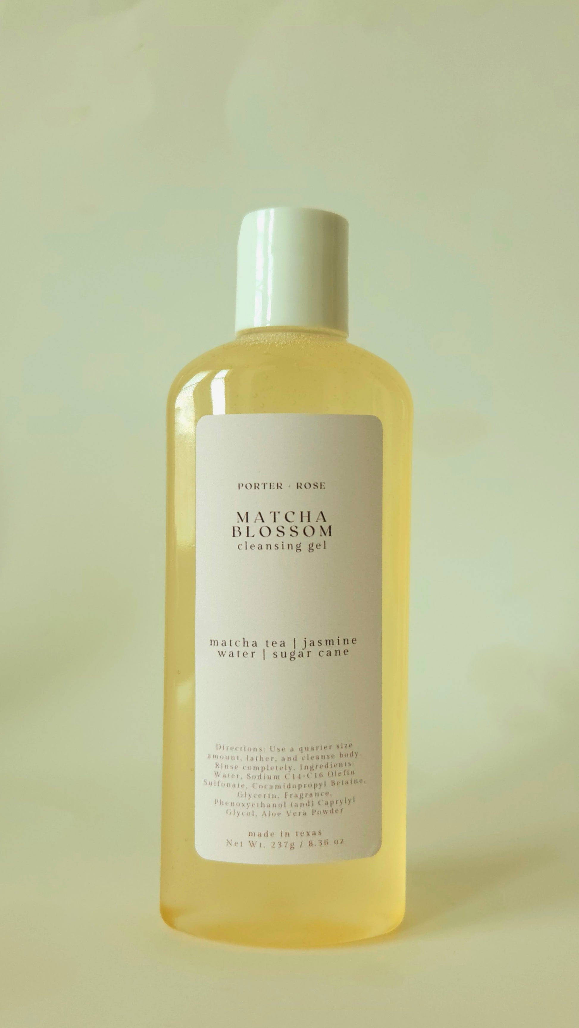 Bottle of Matcha Blossom cleansing gel on a light background