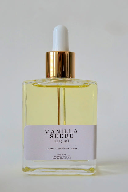 Vanilla Suede body oil bottle with dropper on a white background