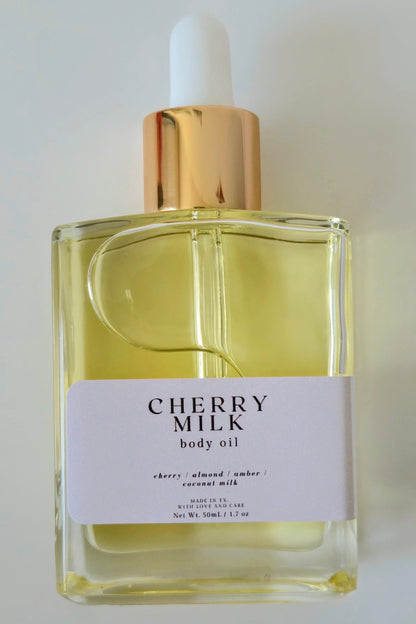 Cherry Milk body oil bottle with dropper on a white background