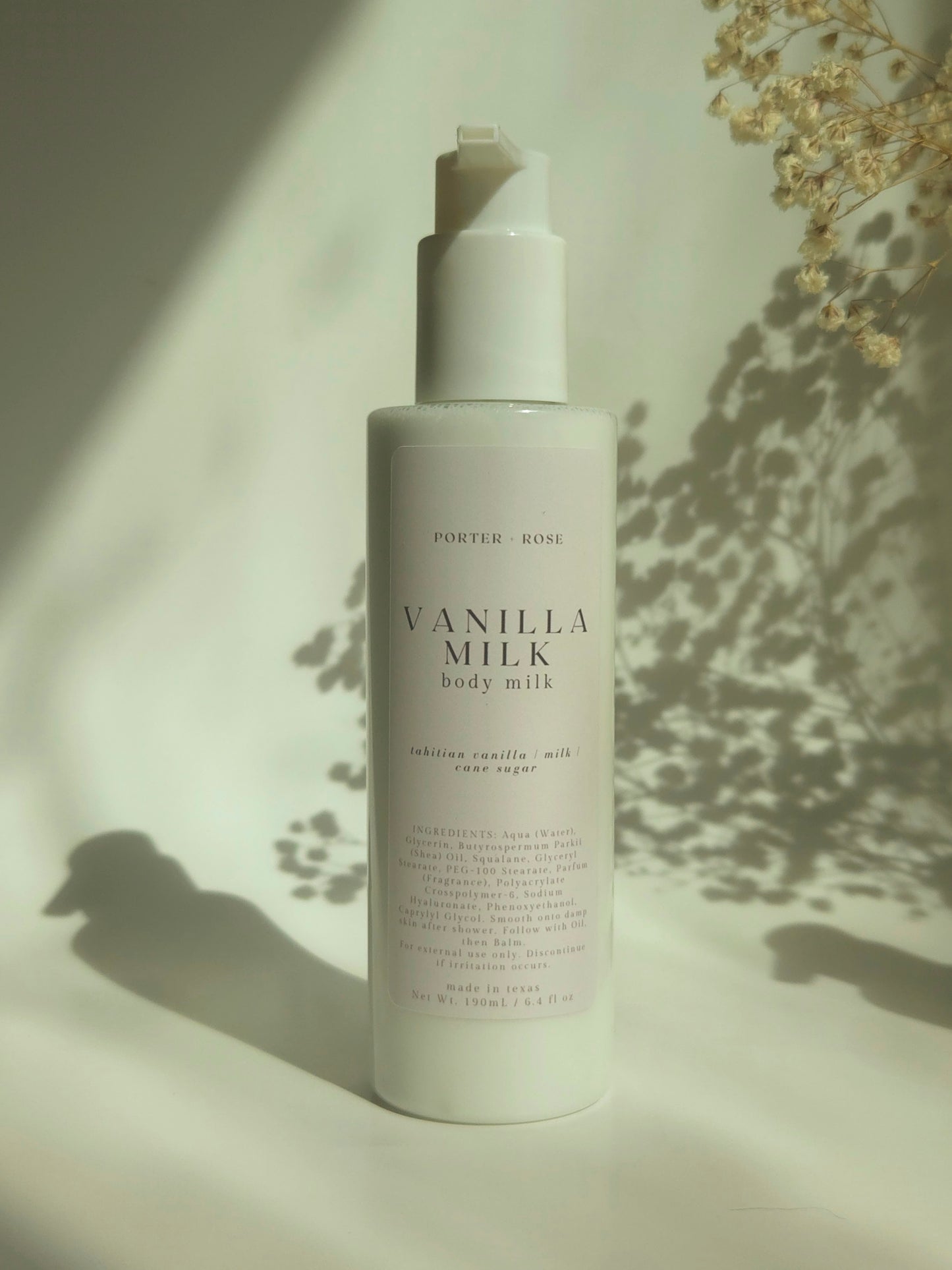 Vanilla milk body milk bottle with a soft background
