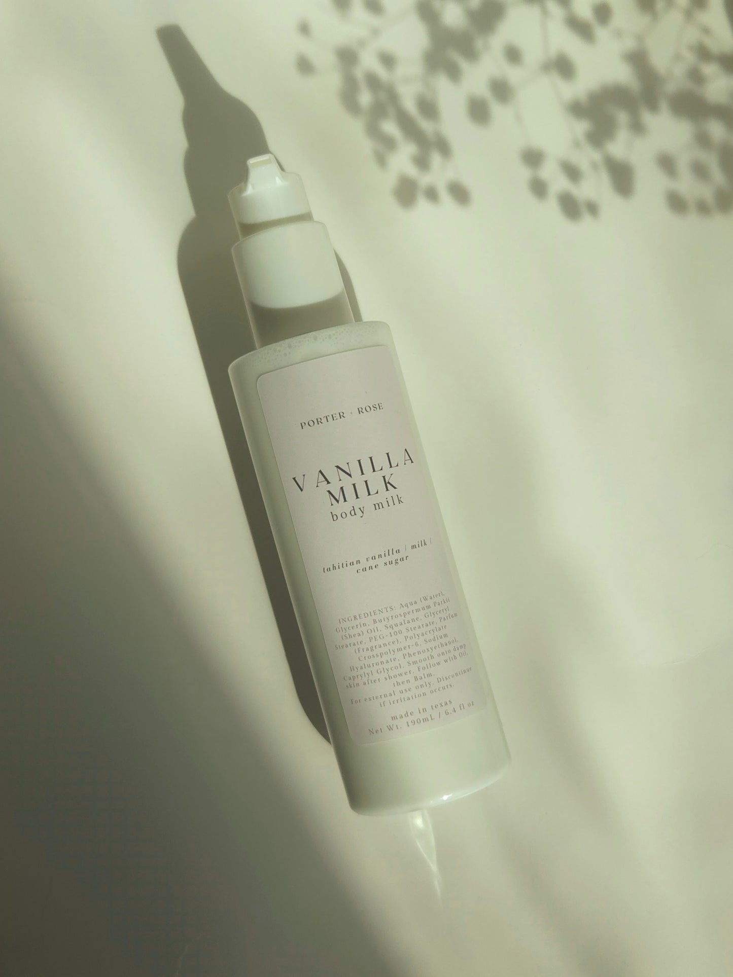 Vanilla milk body milk bottle on a light background