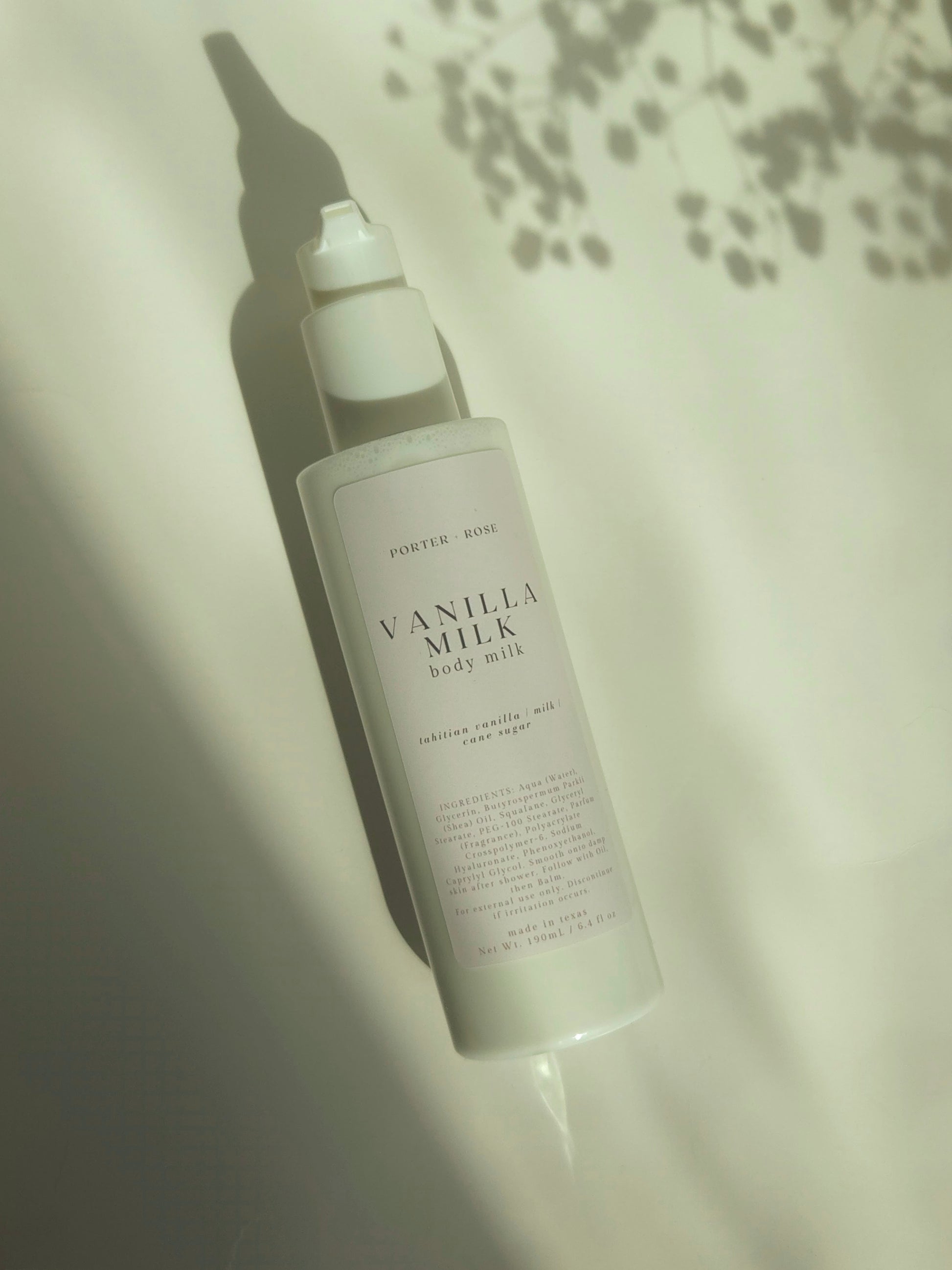 Vanilla milk body milk bottle on a light background