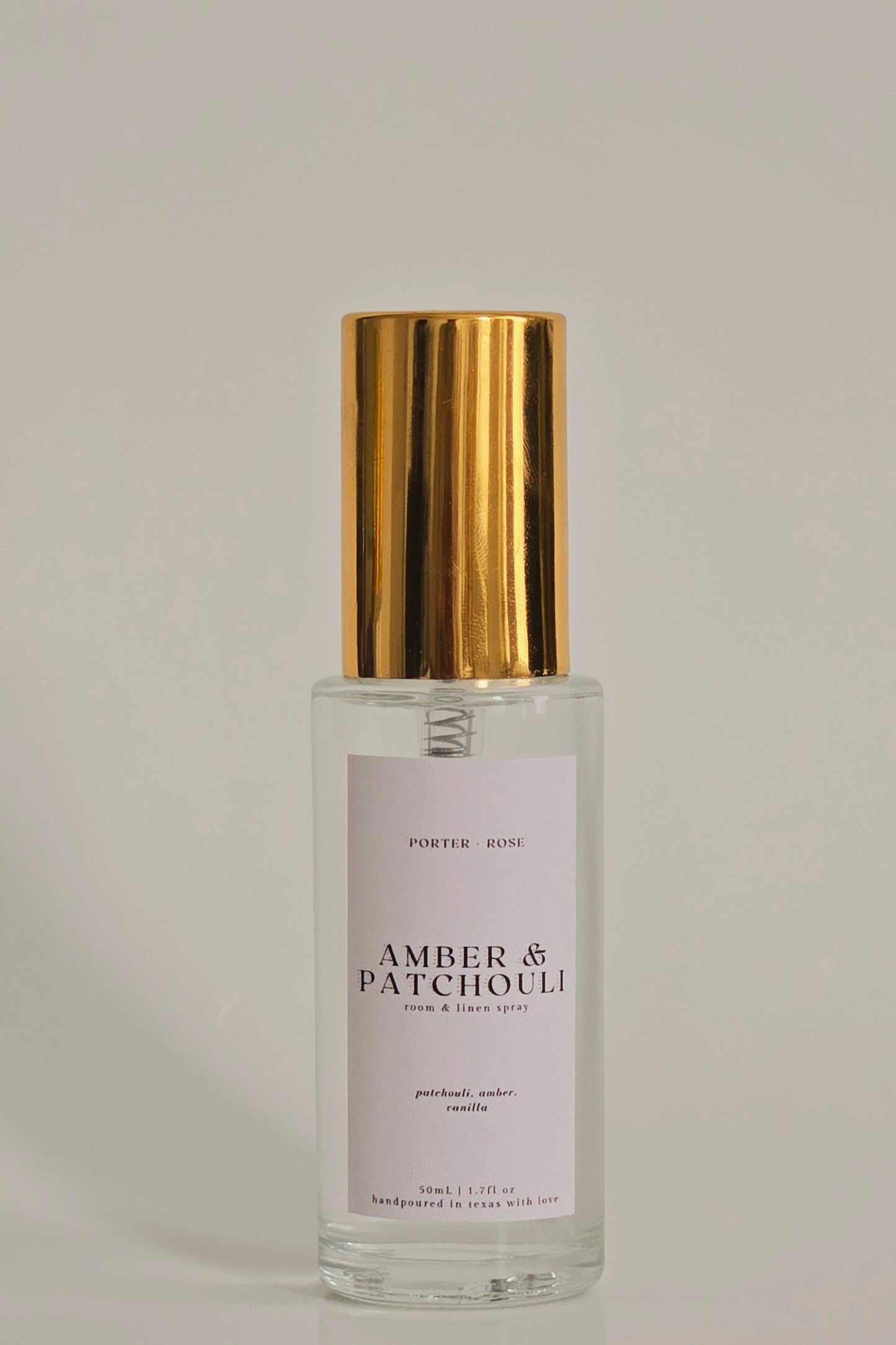 Amber & Patchouli Fragrance Mist in gold rimmed glass spray bottle 50ml porter + rose