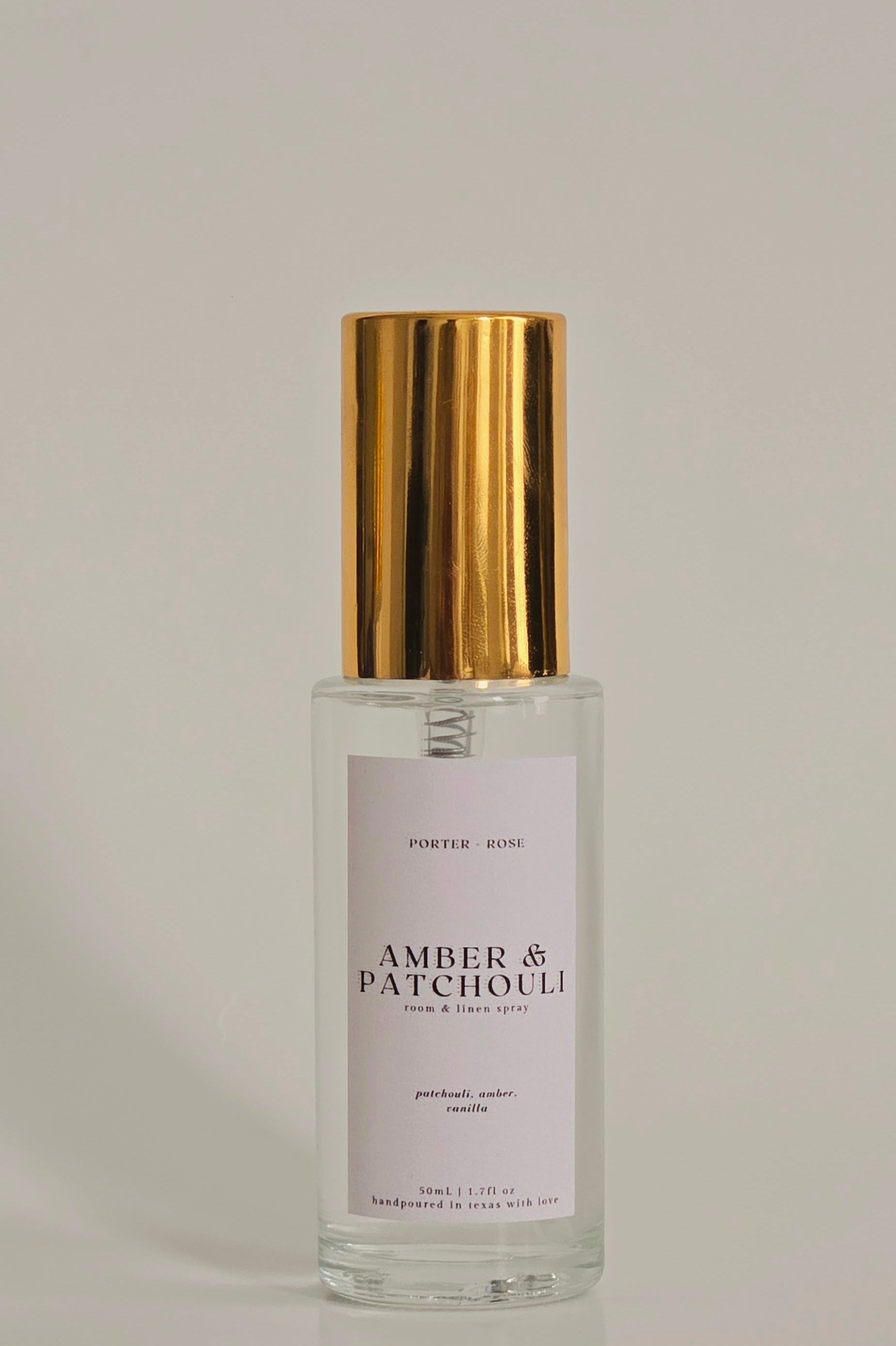 Amber & Patchouli Fragrance Mist in gold rimmed glass spray bottle 50ml porter + rose