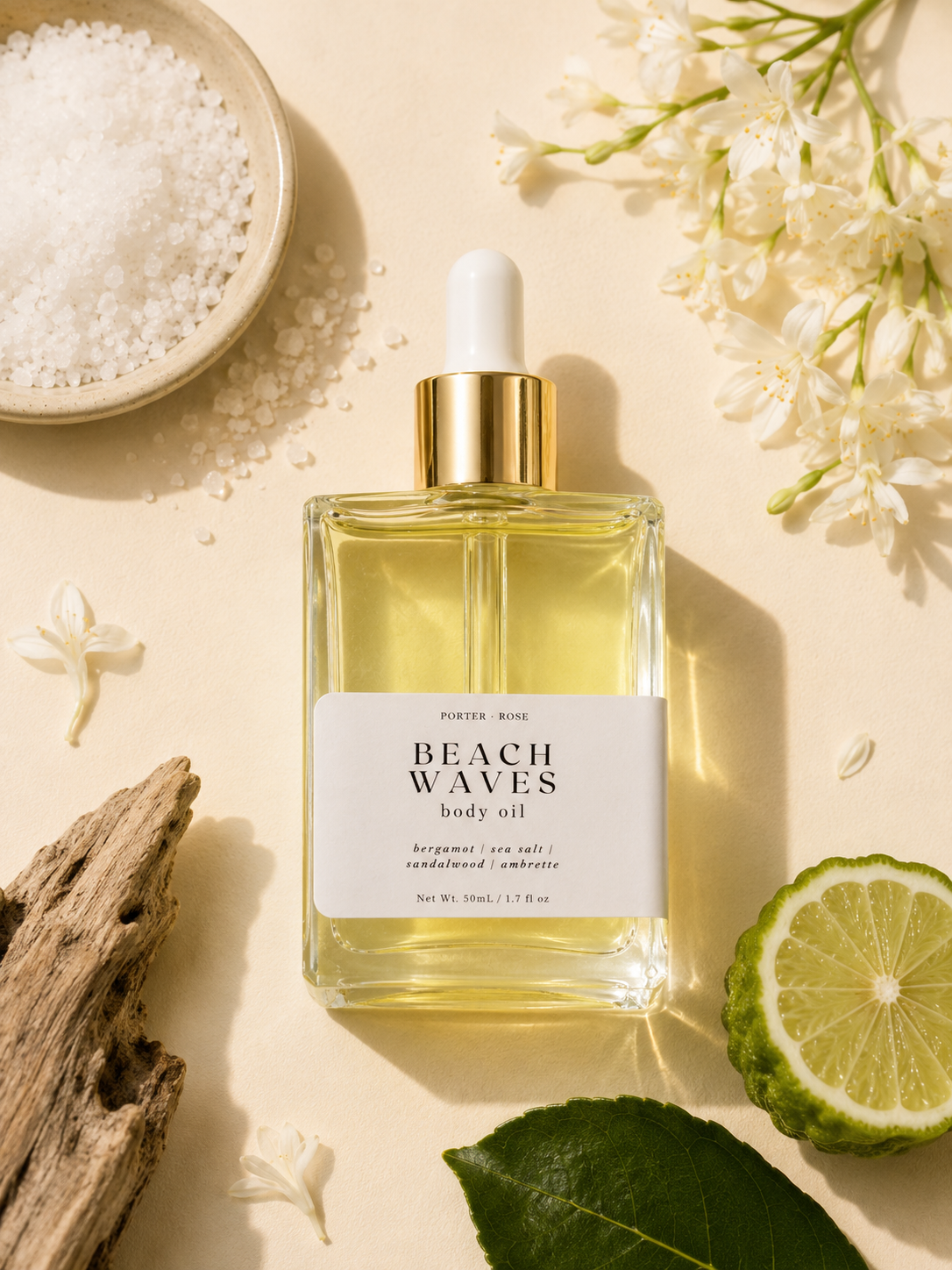 Bottle of 'Beach Waves' body oil with natural elements on a light background
