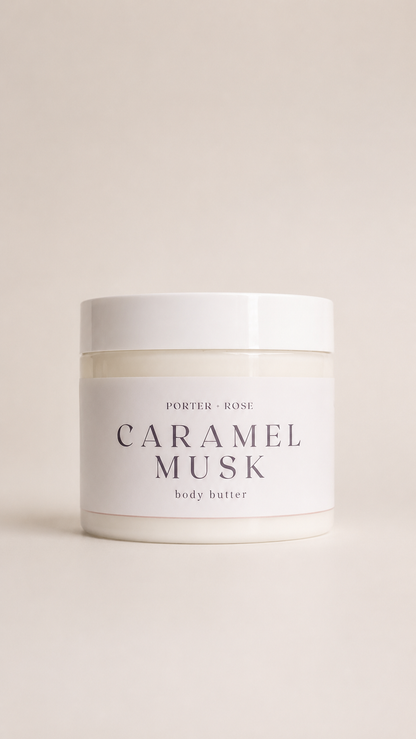 A white plastic jar of Porter Rose Caramel Musk body butter, featuring a minimalist white label with black text, set against a solid light beige background.