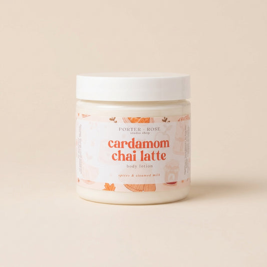 A jar of Porter Rose Body Shop 'cardamom chai latte' body lotion on a light gray background with a soft shadow.