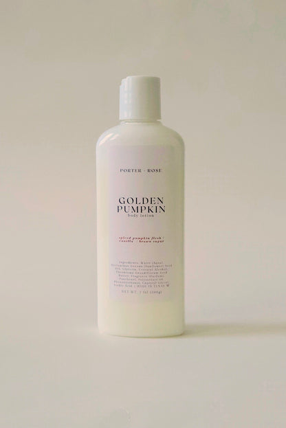 A white plastic bottle of Porter Rose Golden Pumpkin body lotion, featuring a minimalist white label with black text, set against a solid off-white background.