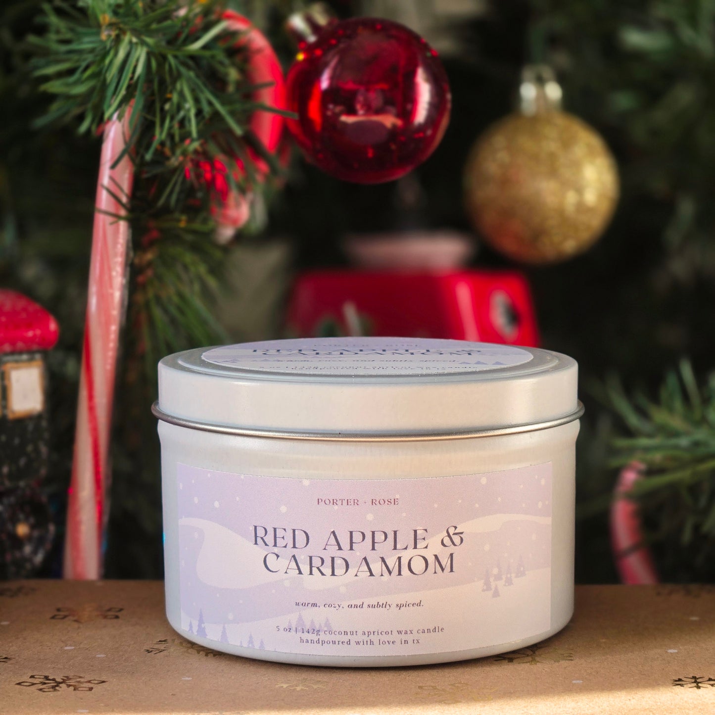 red apple and cardamom scented candle for winter or holiday season wooden wick