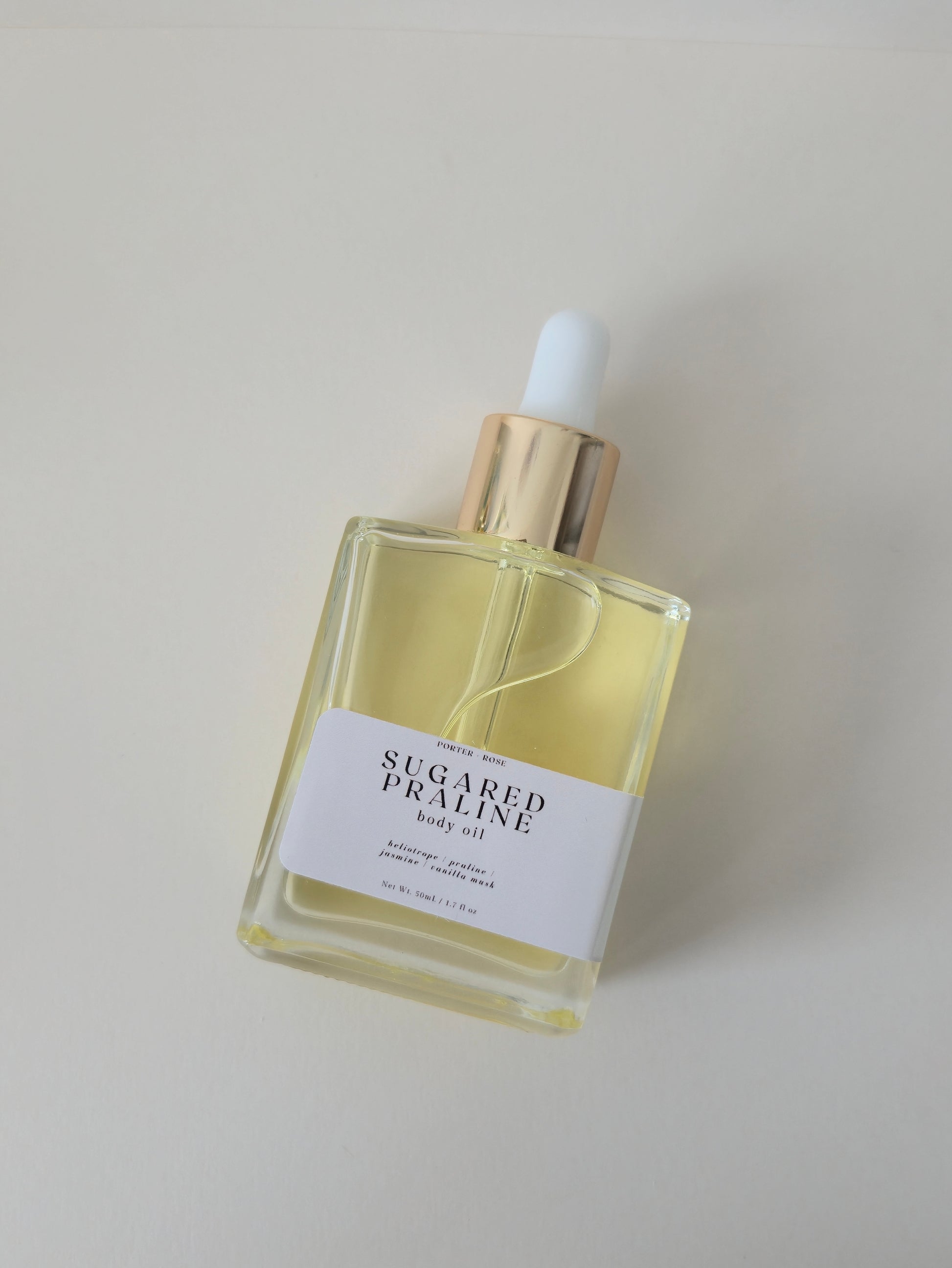 collagen boosting body oil labeled sugared praline