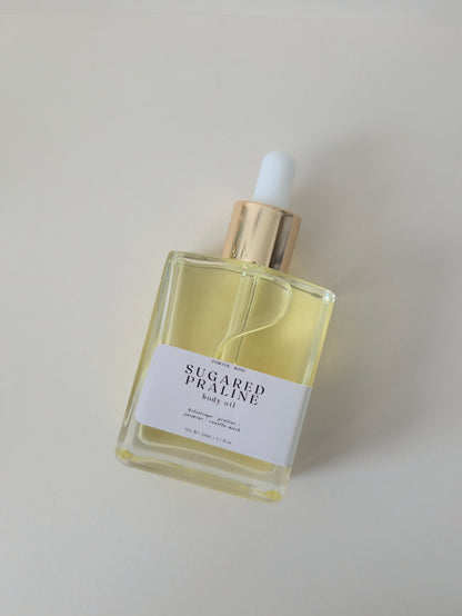 collagen boosting body oil labeled sugared praline