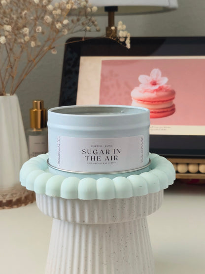 sugar in the air wooden wick candle in tin on blue riser