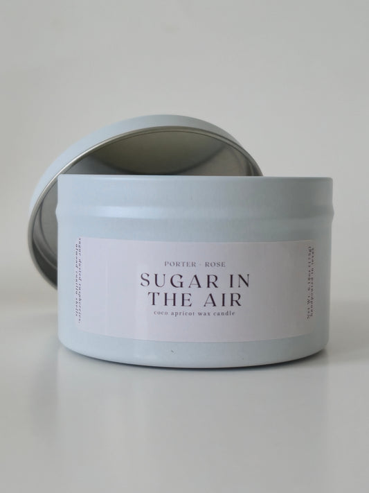 Tin 'Sugar in the Air' Wooden Wick Candle on a light gray background