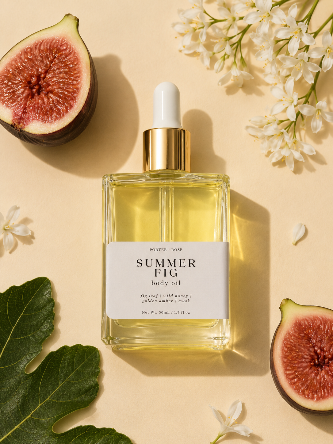 Bottle of 'Summer Fig' body oil with figs and flowers on a beige background