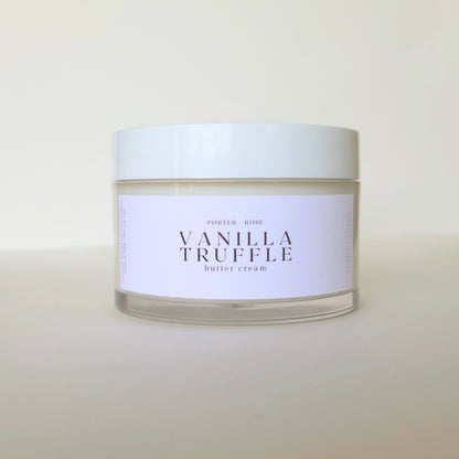 Jar of vanilla truffle body butter cream with a white label on a light background