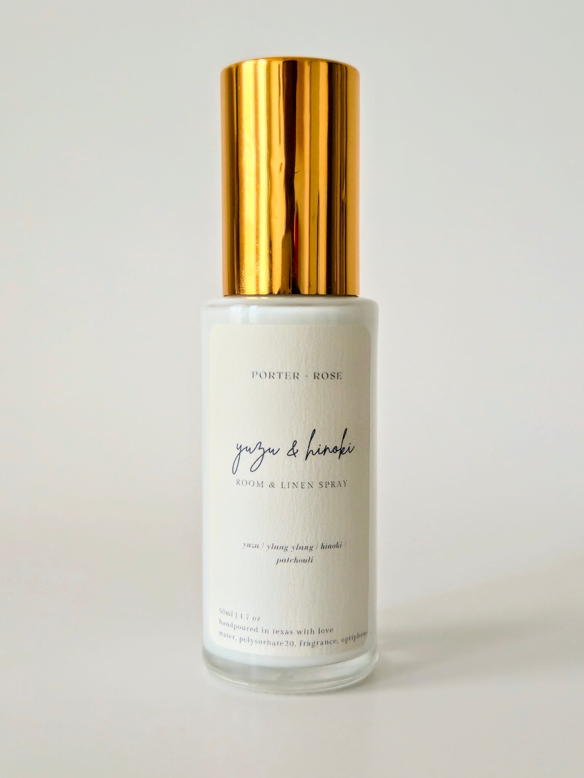 Close-up of Yuzu & Hinoki spray bottle showing natural ingredients label